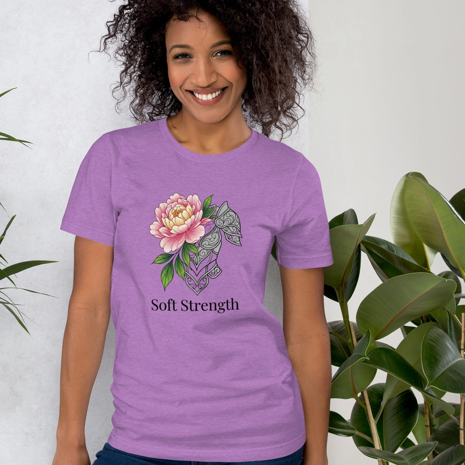 An African American Gen Z lady wearing Nourivra Co. original colored graphic design of Heather/Purple Soft Strength tee shirt